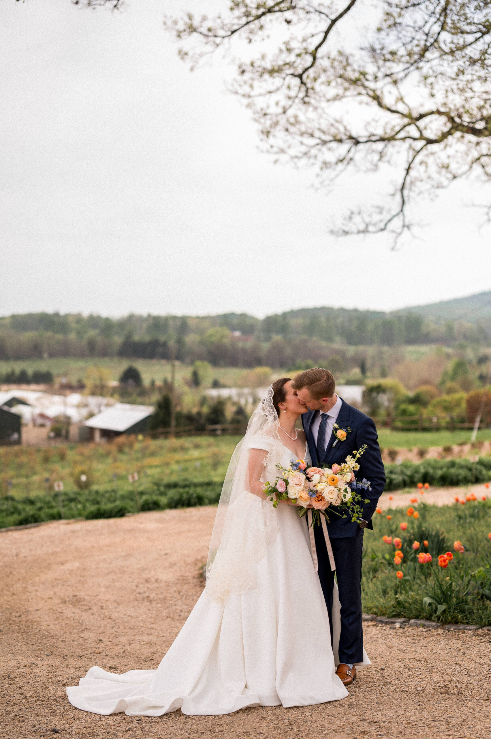 A couple kisses during their Market at Grelen Wedding, photographed by Hunter and Sarah Photography