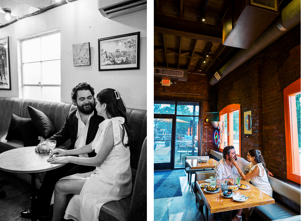 A couple looks intimately into each other's eyes in Downtown Belmont in Charlottesville, VA. Their engagement photos are inside a restautant, and the table is full of food