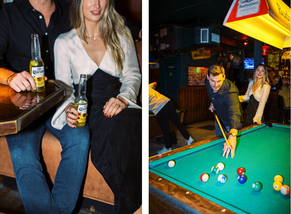 A handsome couple plays billiards and drinks Coronas at Pete's Bar in Jacksonville Beach, FL during a travel lifestyle engagement photoshoot